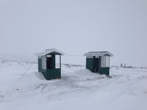 Outhouses secured from the wind with heavy cable